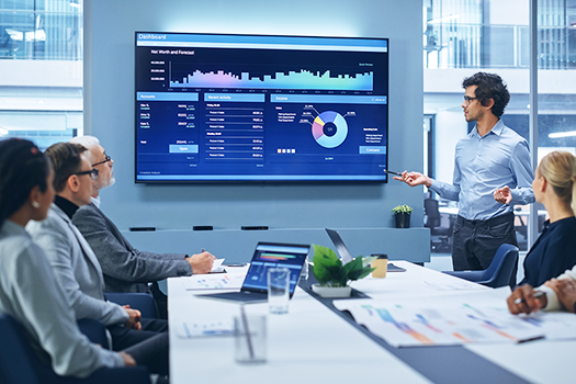 man giving presentation on data to colleagues